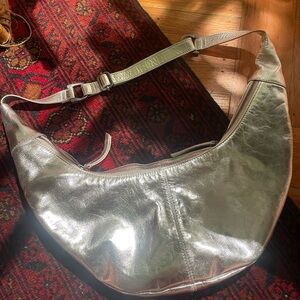 FREE PEOPLE IDLE HANDS SLING BAG METALLIC SILVER